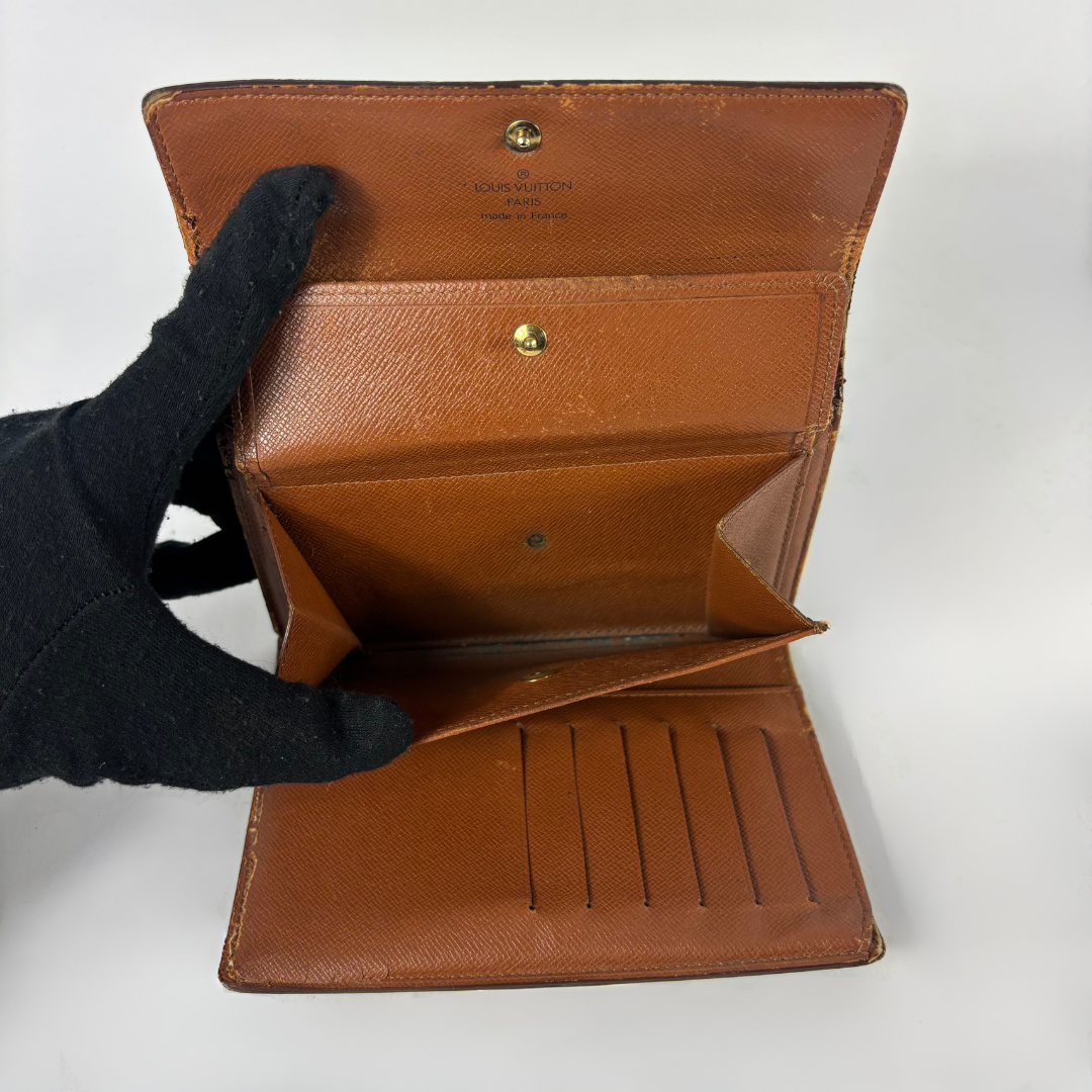 Louis Vuitton International Wallet Medium on a white background