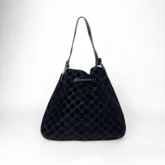 Gucci GG black suede shoulder bag on a white background