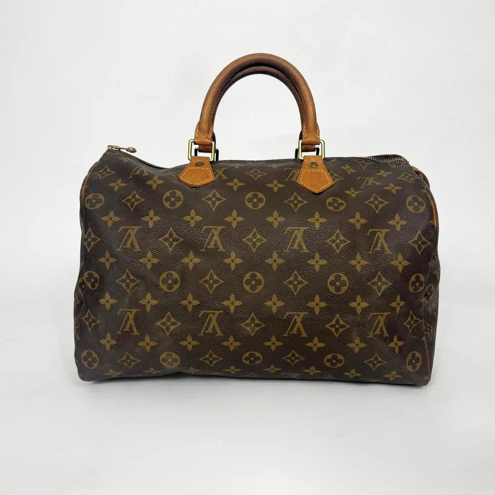 Brown patterned handbag on a white background