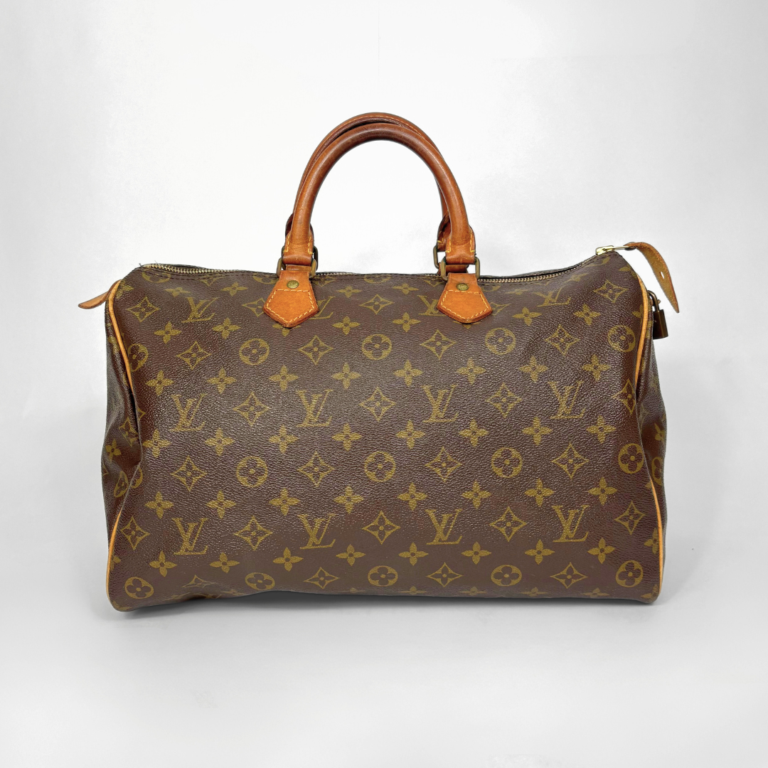 Brown Louis Vuitton handbag with monogram pattern on a white background