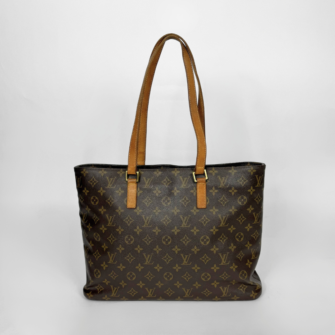 Designer handbag with monogram pattern on a white background