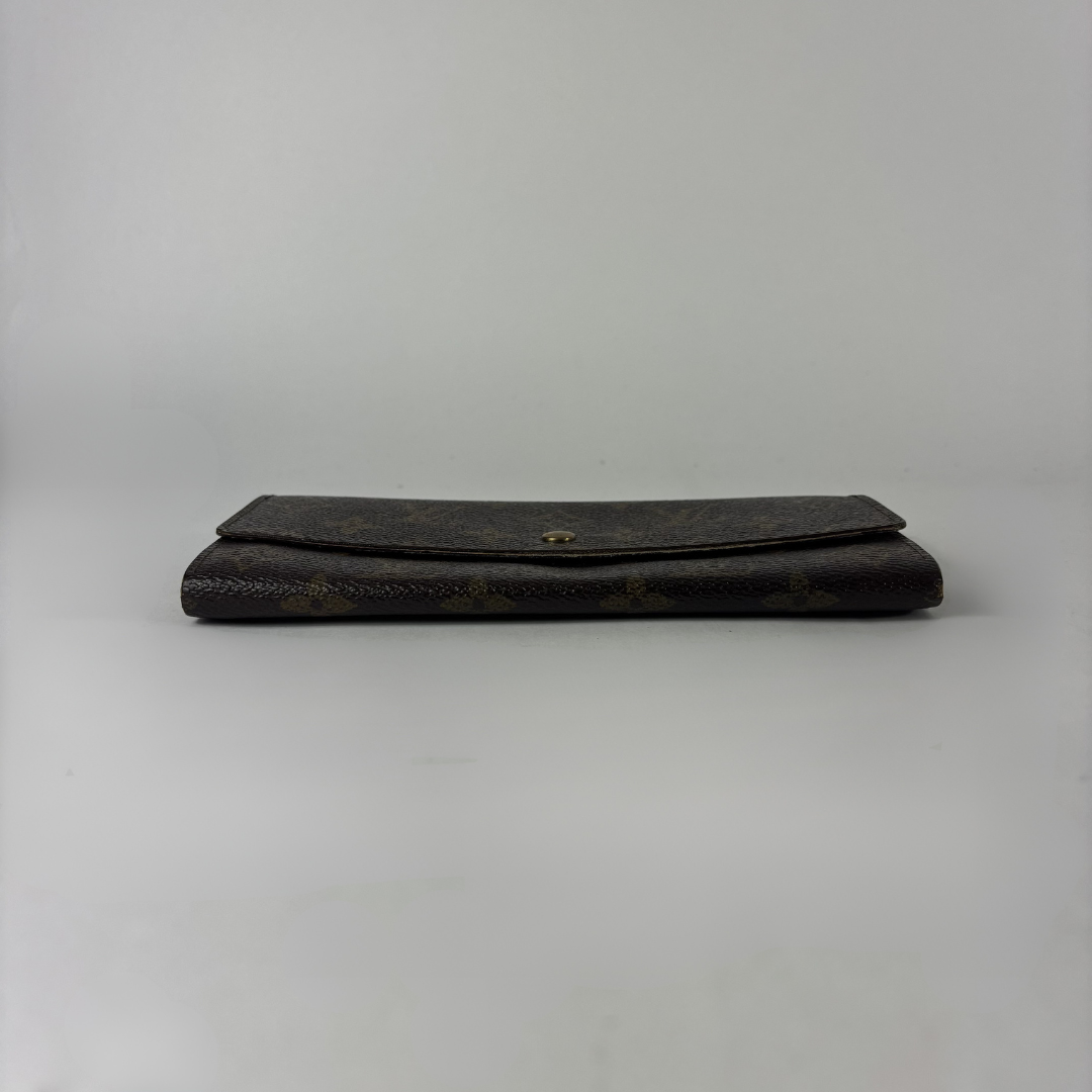 Louis Vuitton wallet on white background