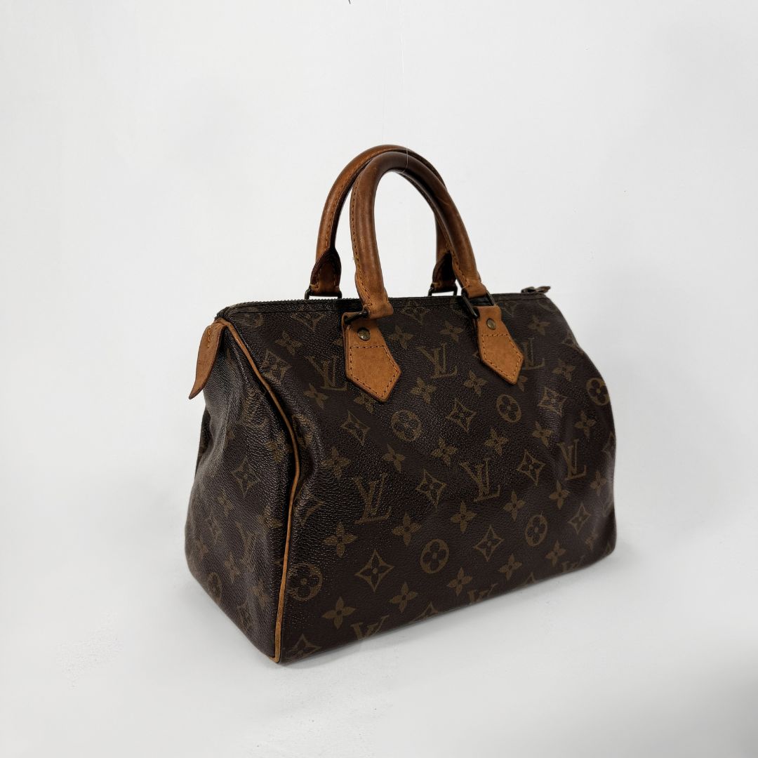 A Louis Vuitton monogram canvas handbag with brown leather handles and trim, photographed on a clean white studio background.