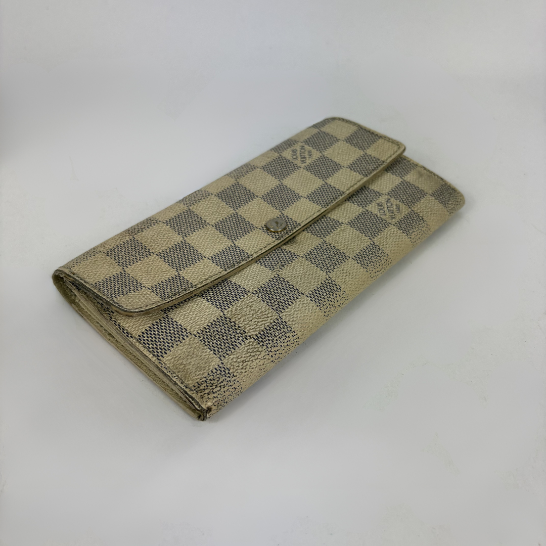 Louis Vuitton wallet on white background