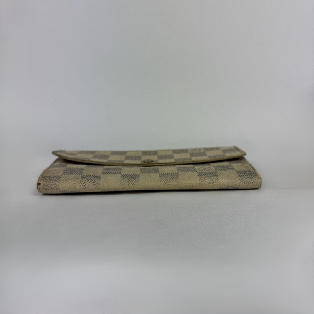 Louis Vuitton wallet on white background