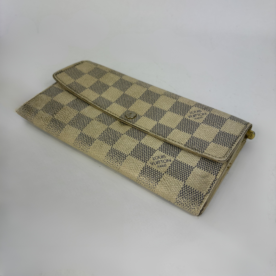 Louis Vuitton wallet on white background