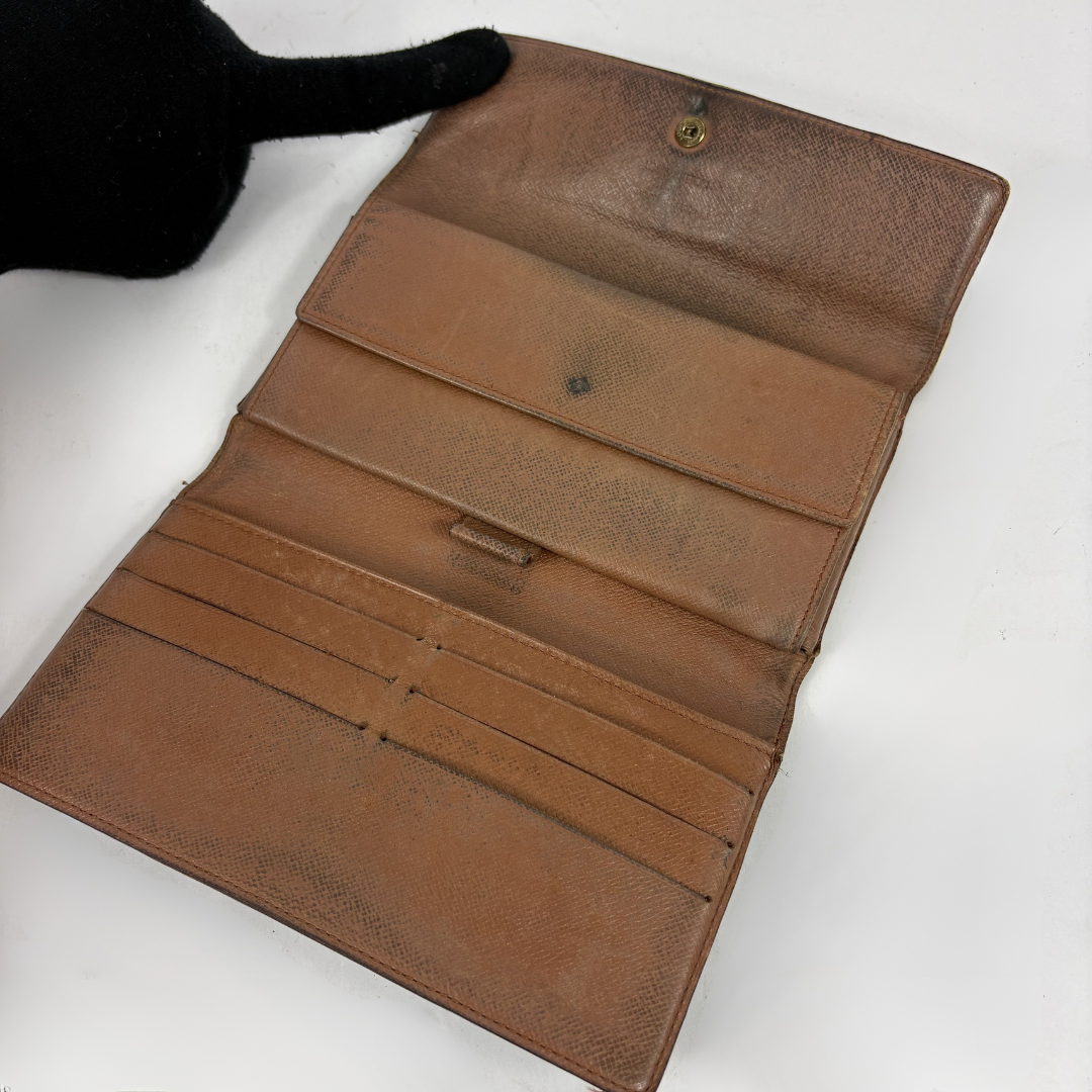 Louis Vuitton wallet on white background