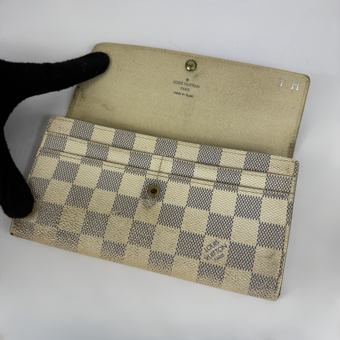 Louis Vuitton wallet on white background