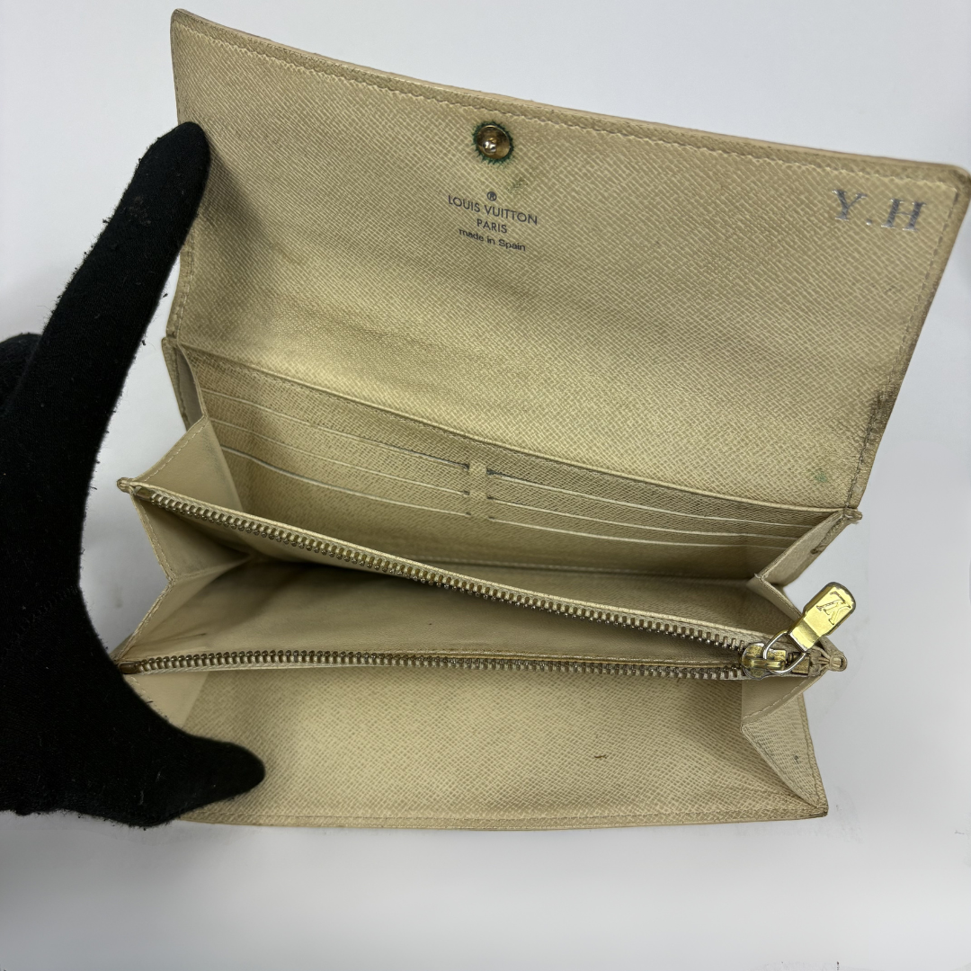 Louis Vuitton wallet on white background