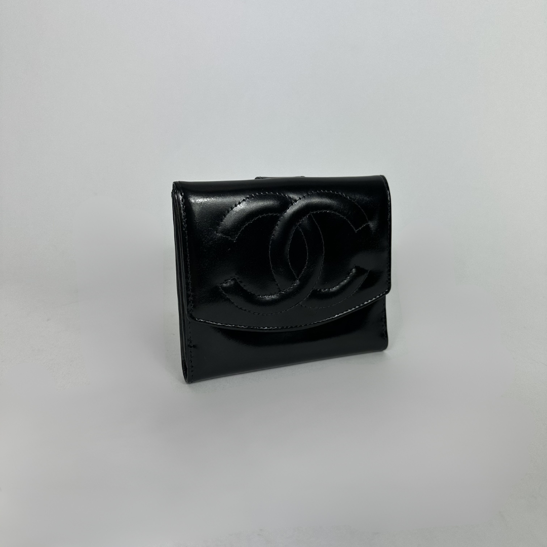 Black Chanel wallet on white background