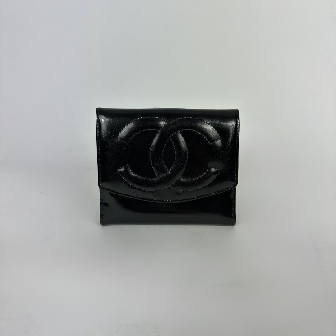 Black Chanel wallet on white background