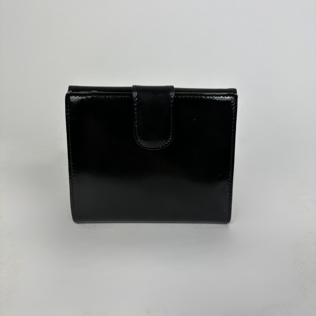 Black Chanel wallet on white background
