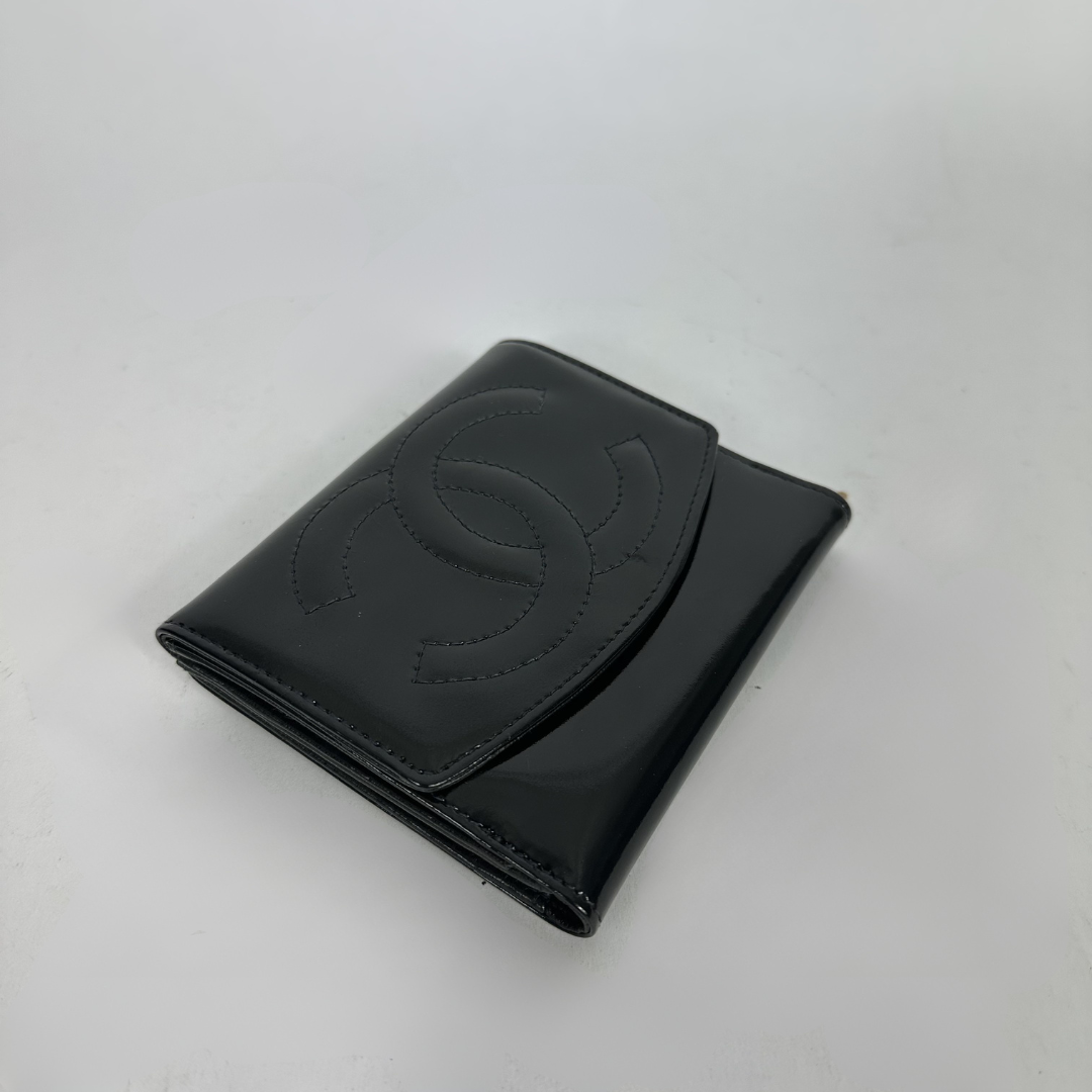 Black Chanel wallet on white background