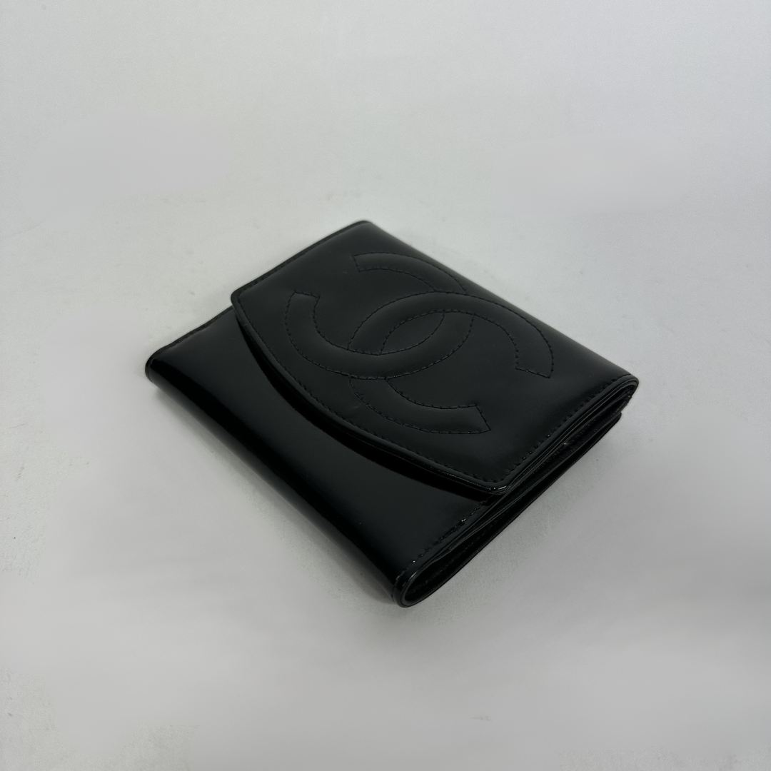 Black Chanel wallet on white background