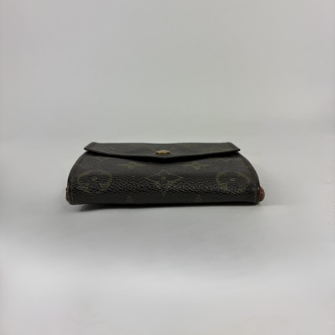 Louis Vuitton Druk Wallet on a white background
