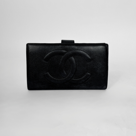 A black textured leather clutch bag with an embossed interlocking CC logo, characteristic of Chanel, set against a plain light gray background.