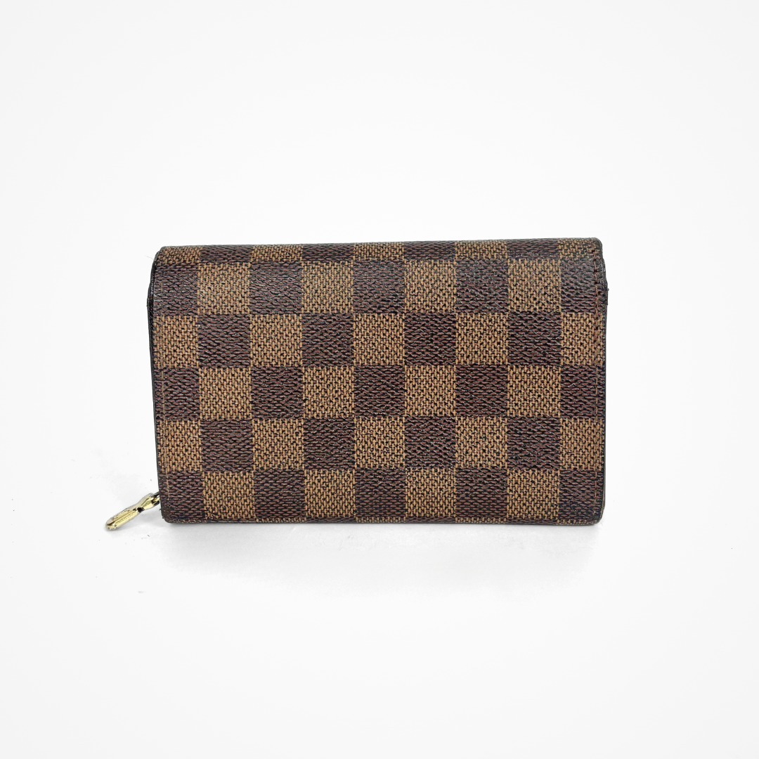 Brown checkered LV wallet with gold accents on a white background
