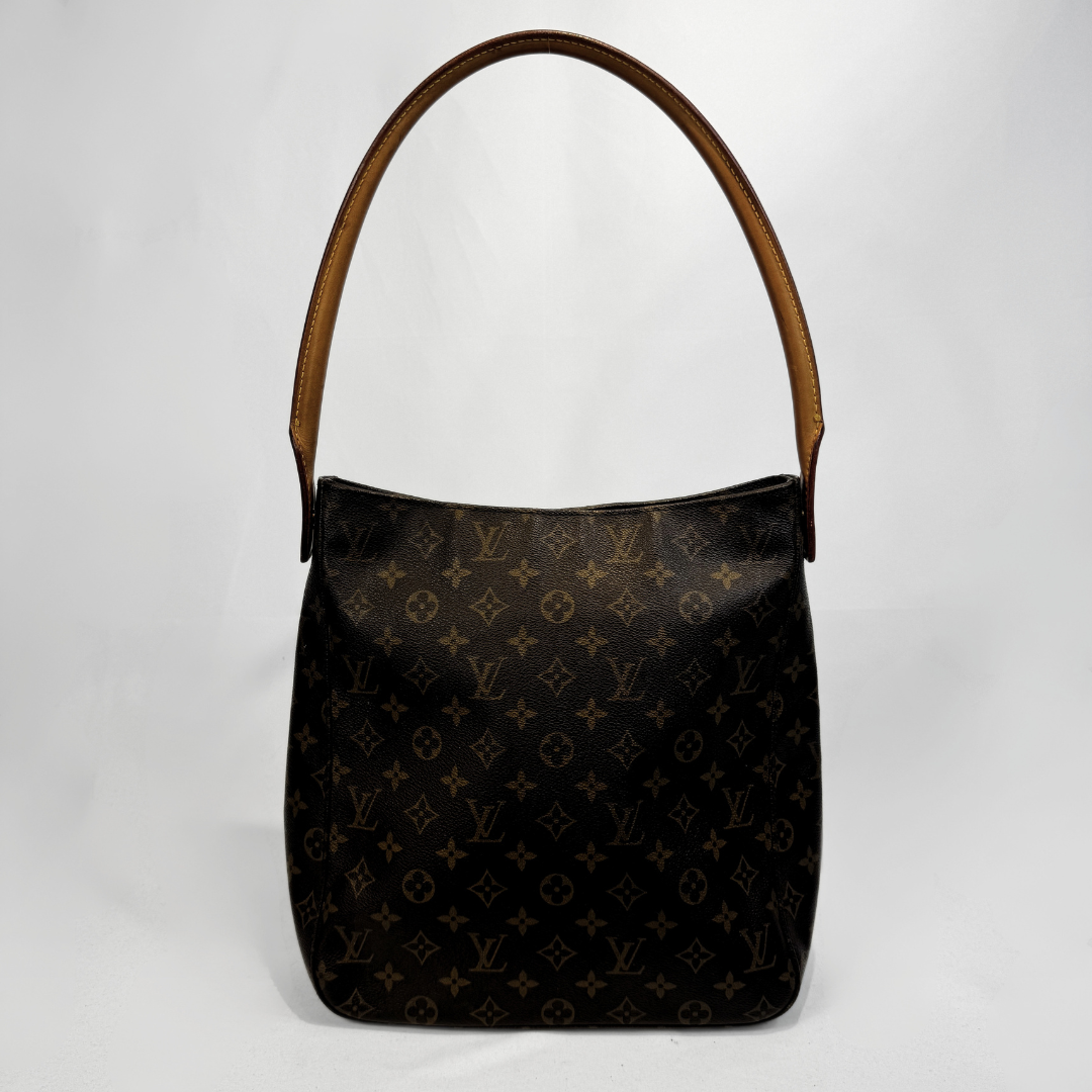 Louis Vuitton monogram canvas shoulder bag with a brown leather handle, photographed against a light gray background.