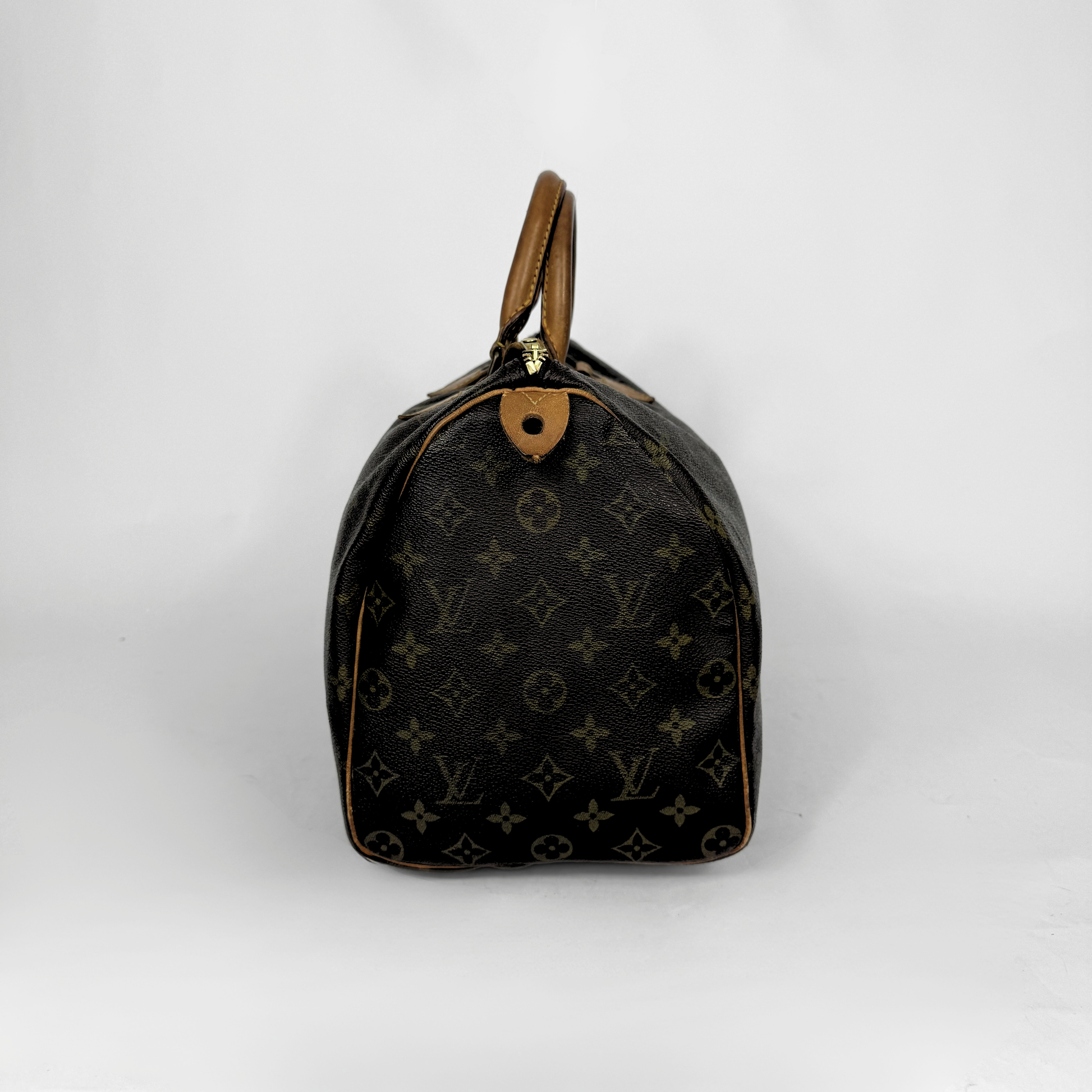 Louis Vuitton monogram handbag on a white background