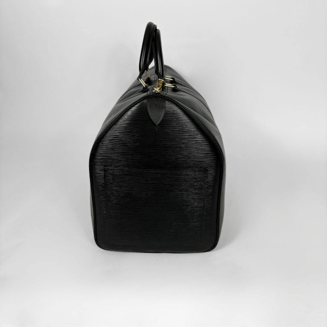 Black handbag on a light gray background