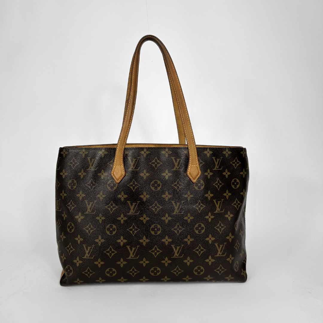 Louis Vuitton monogram canvas tote bag with tan leather shoulder straps, shown against a plain light gray background.