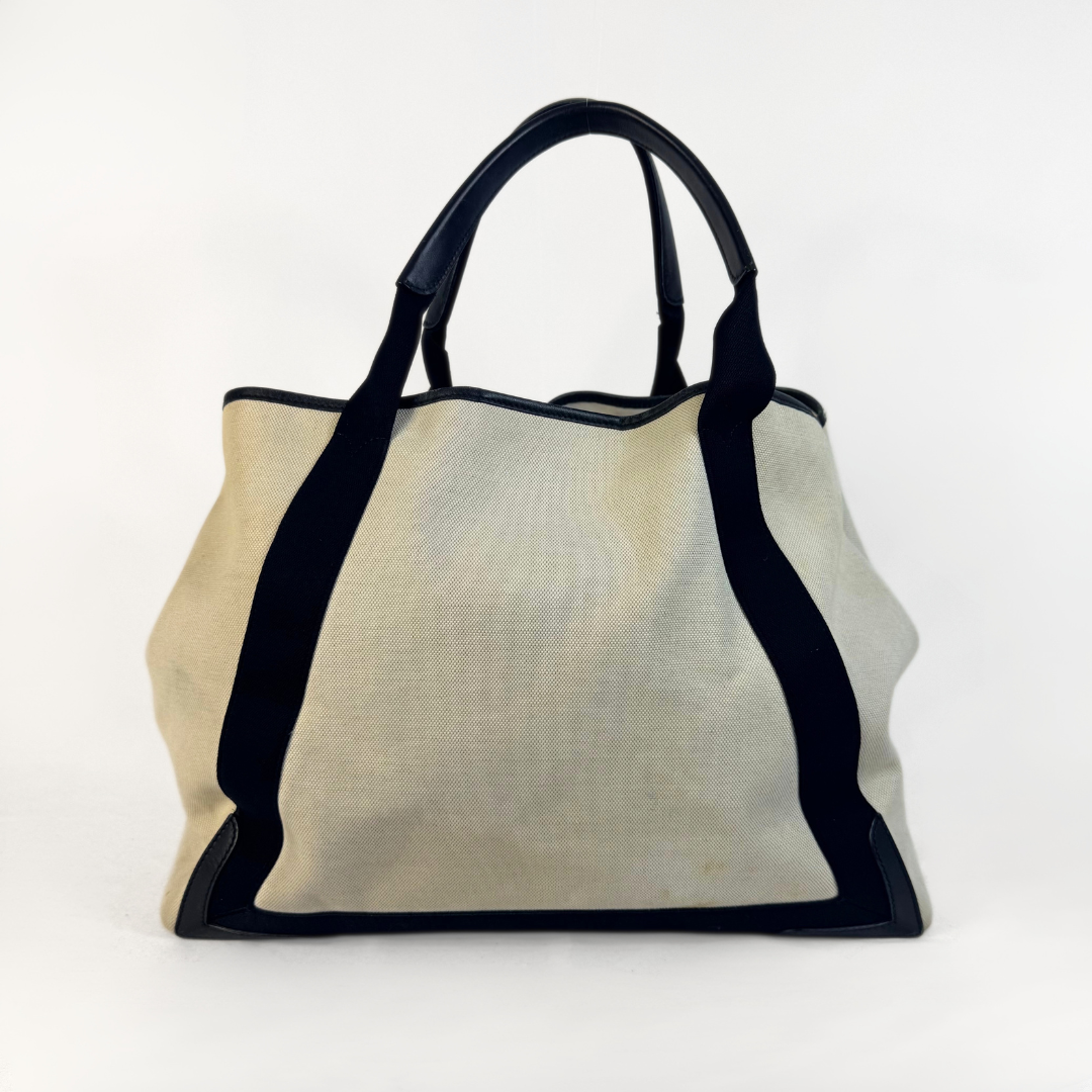 Balenciaga tote bag with black accents on a light gray background