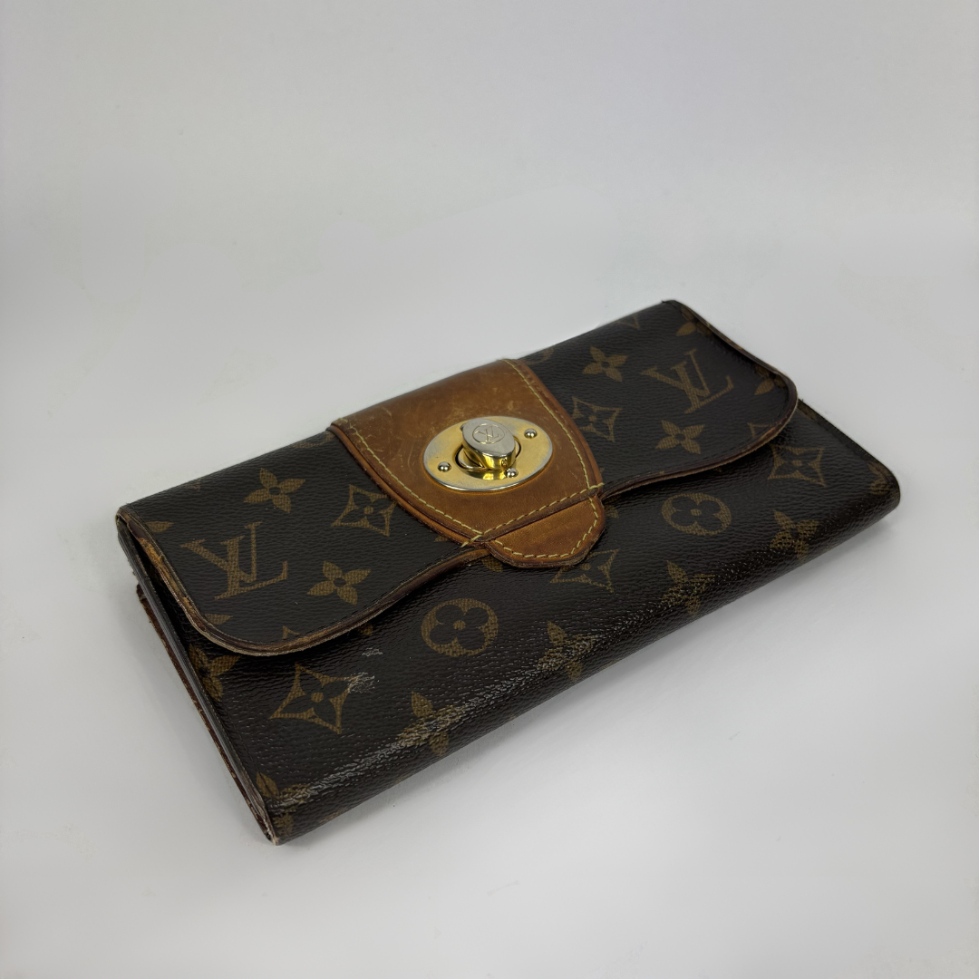 Louis Vuitton Wallet in front of white background