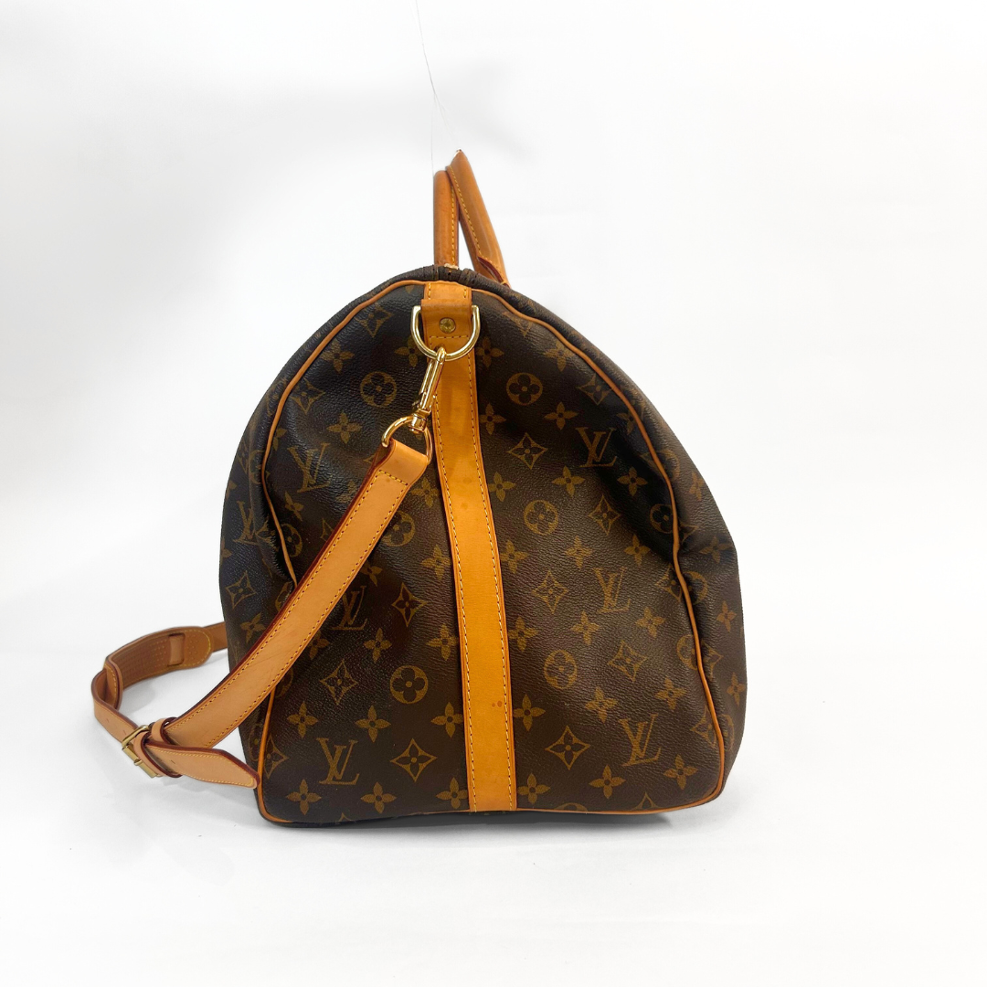 Designer backpack with monogram pattern on a white background