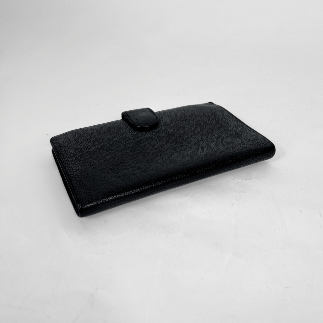 beige wallet on white background