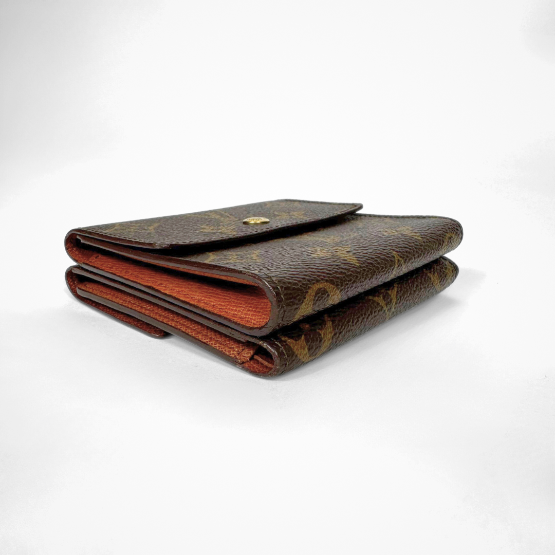 Louis Vuitton Druk Wallet on a white background