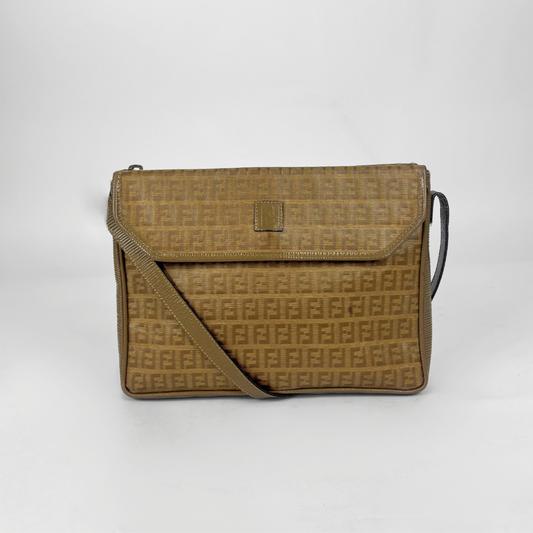 Brown patterned handbag on a white background