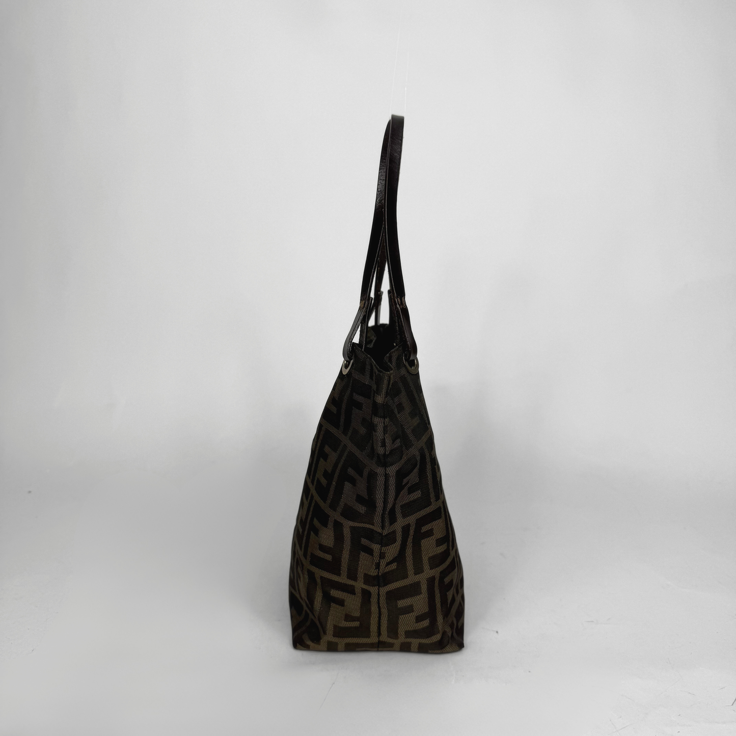 Black patterned handbag on a white background