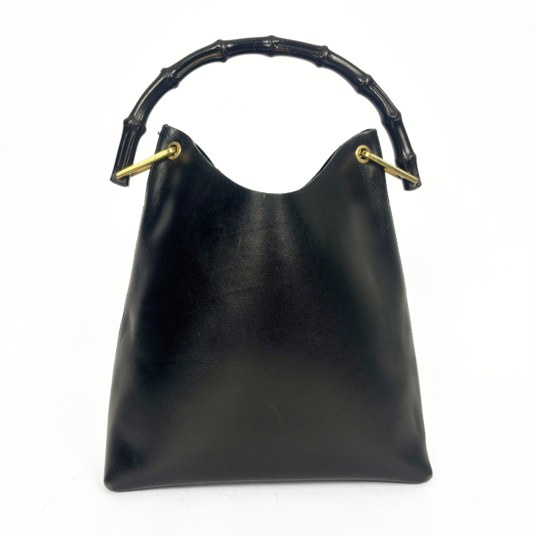 Gucci vintage black leather hobo hag with a dark wood bamboo top handle and gold-tone hardware.