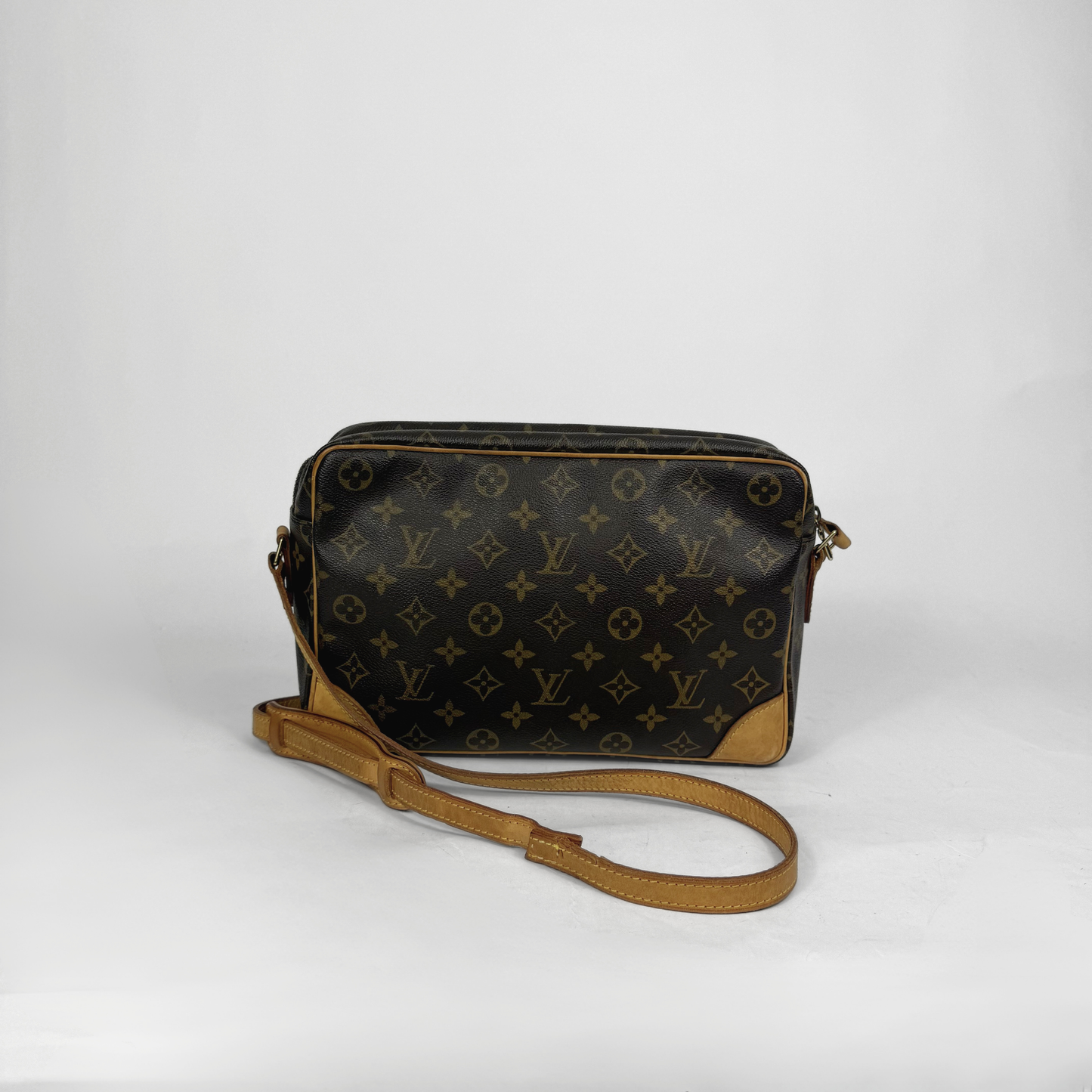 Brown handbag with gold monogram pattern 