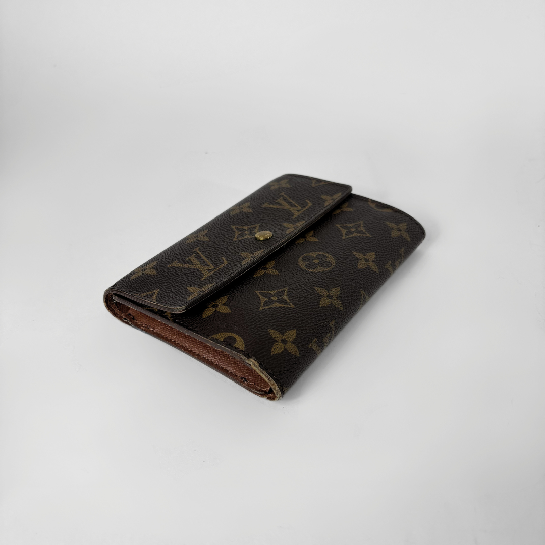 Louis Vuitton International Wallet Medium on a white background