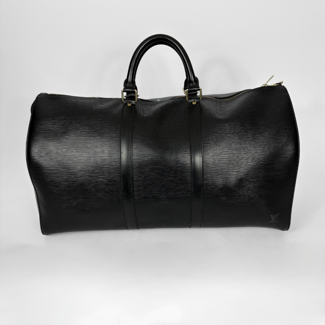 Black leather duffel bag on a white background