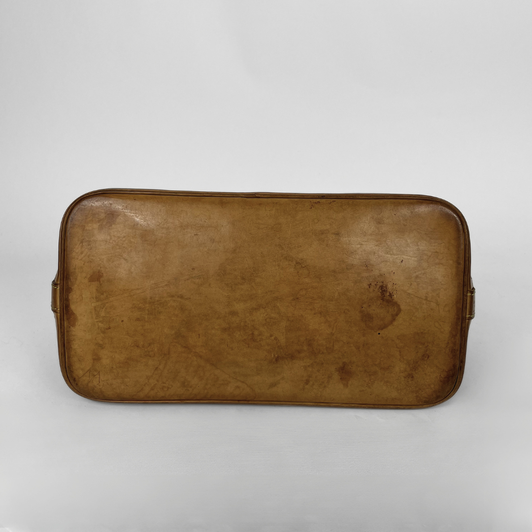Louis Vuitton Alma Monogram Canvas on a white background