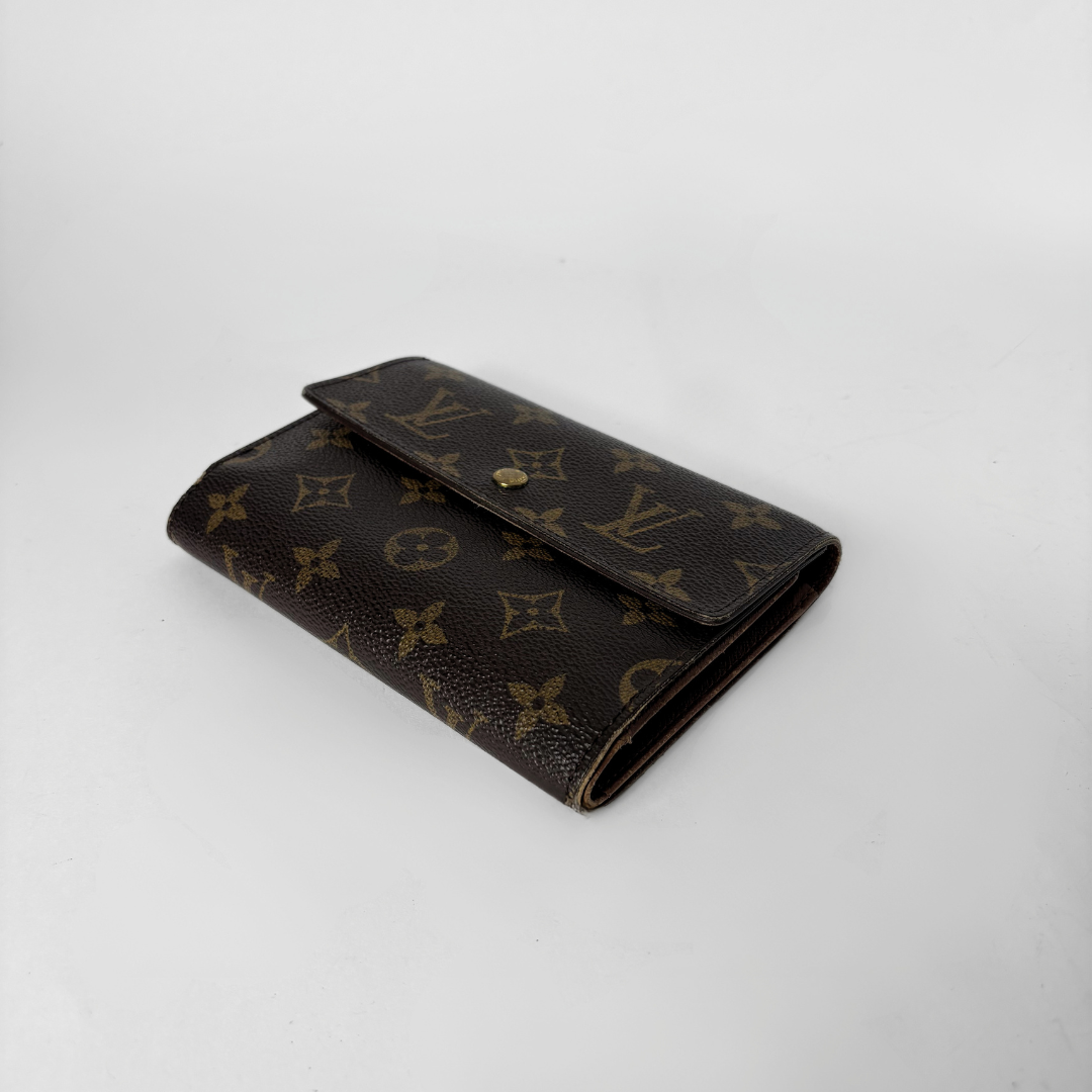 Louis Vuitton International Wallet Medium on a white background