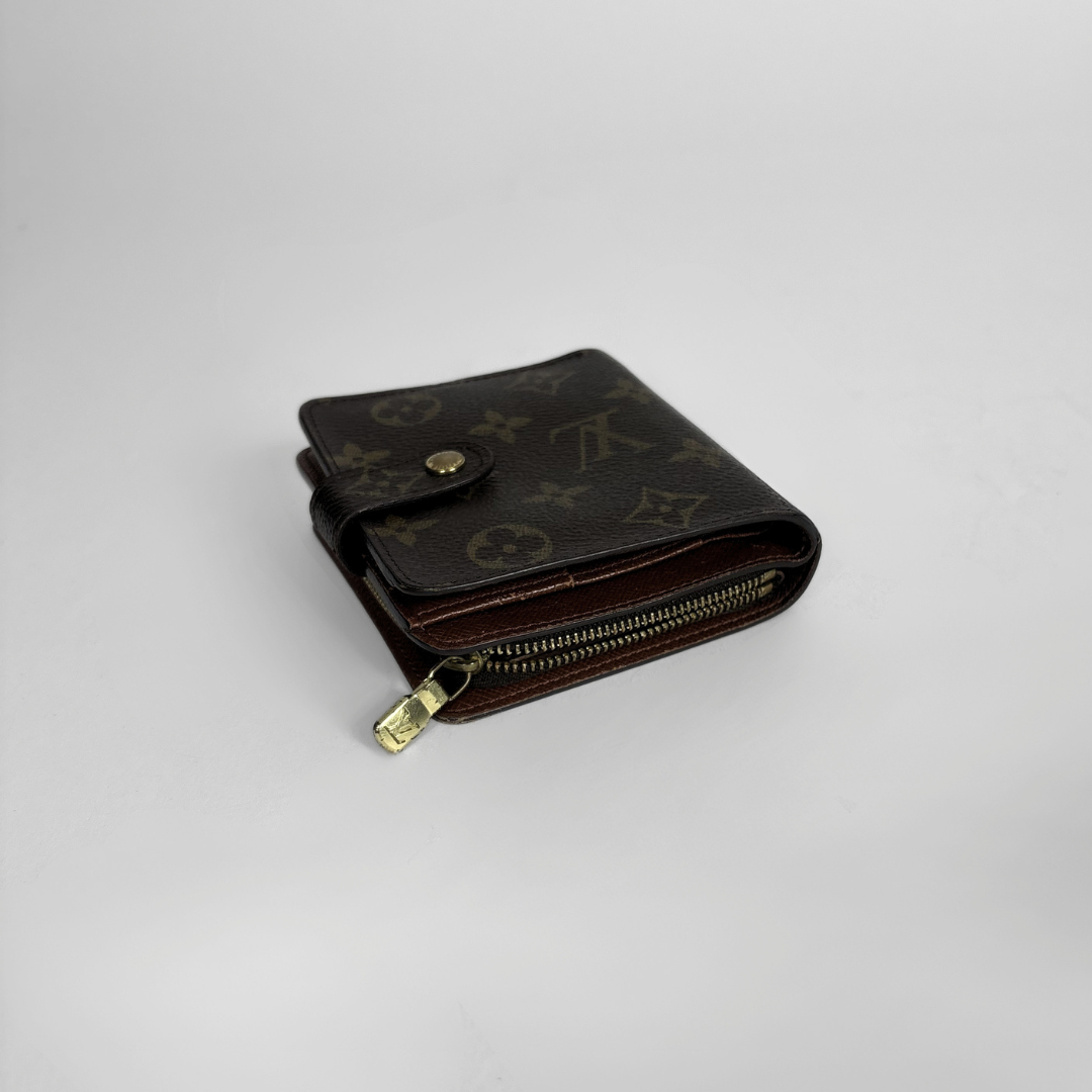 Brown LV wallet with gold accents on a light gray background