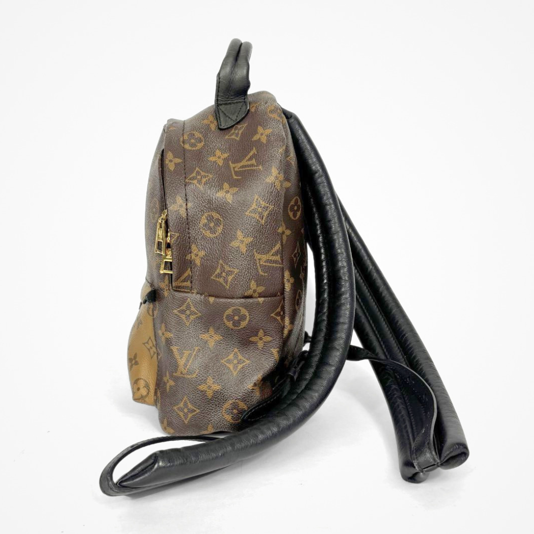 Louis Vuitton backpack with monogram pattern on a white background
