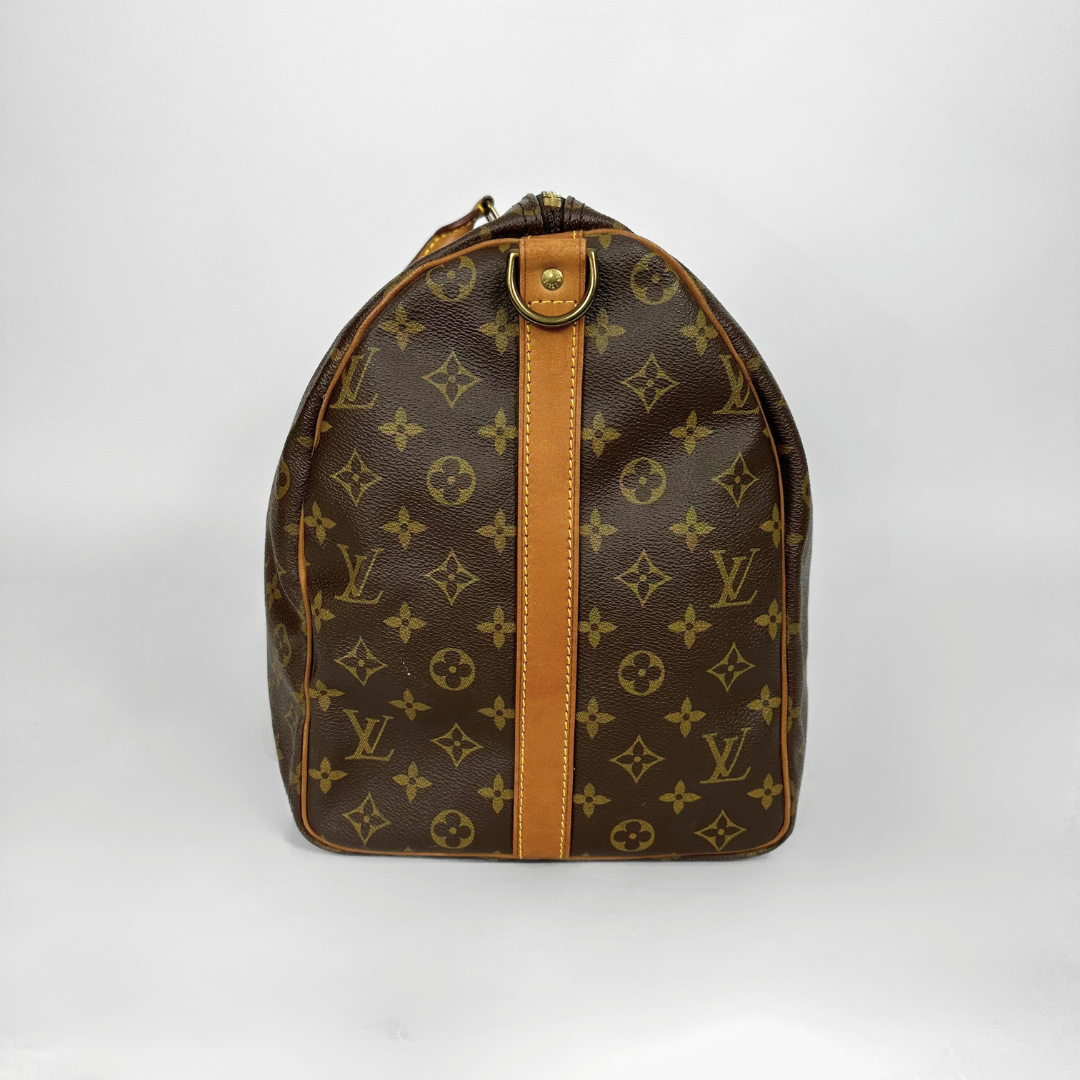 Brown Louis Vuitton bag with monogram pattern on a white background
