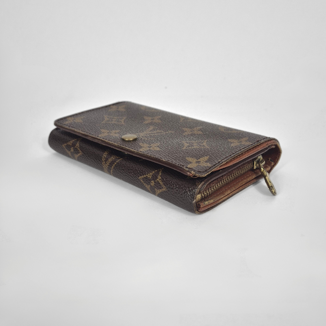 Brown wallet with pattern on a white background