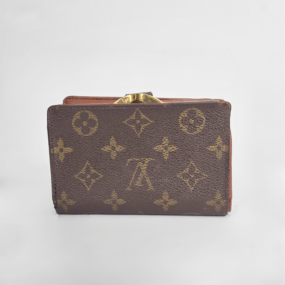 Brown leather wallet with gold accents on a light gray background