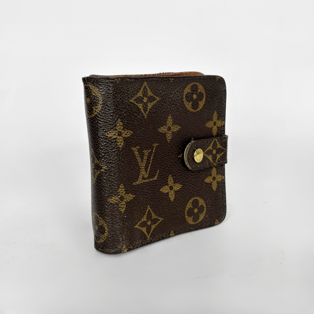 LV compact wallet in signature brown monogram canvas with a snap-button strap closure.