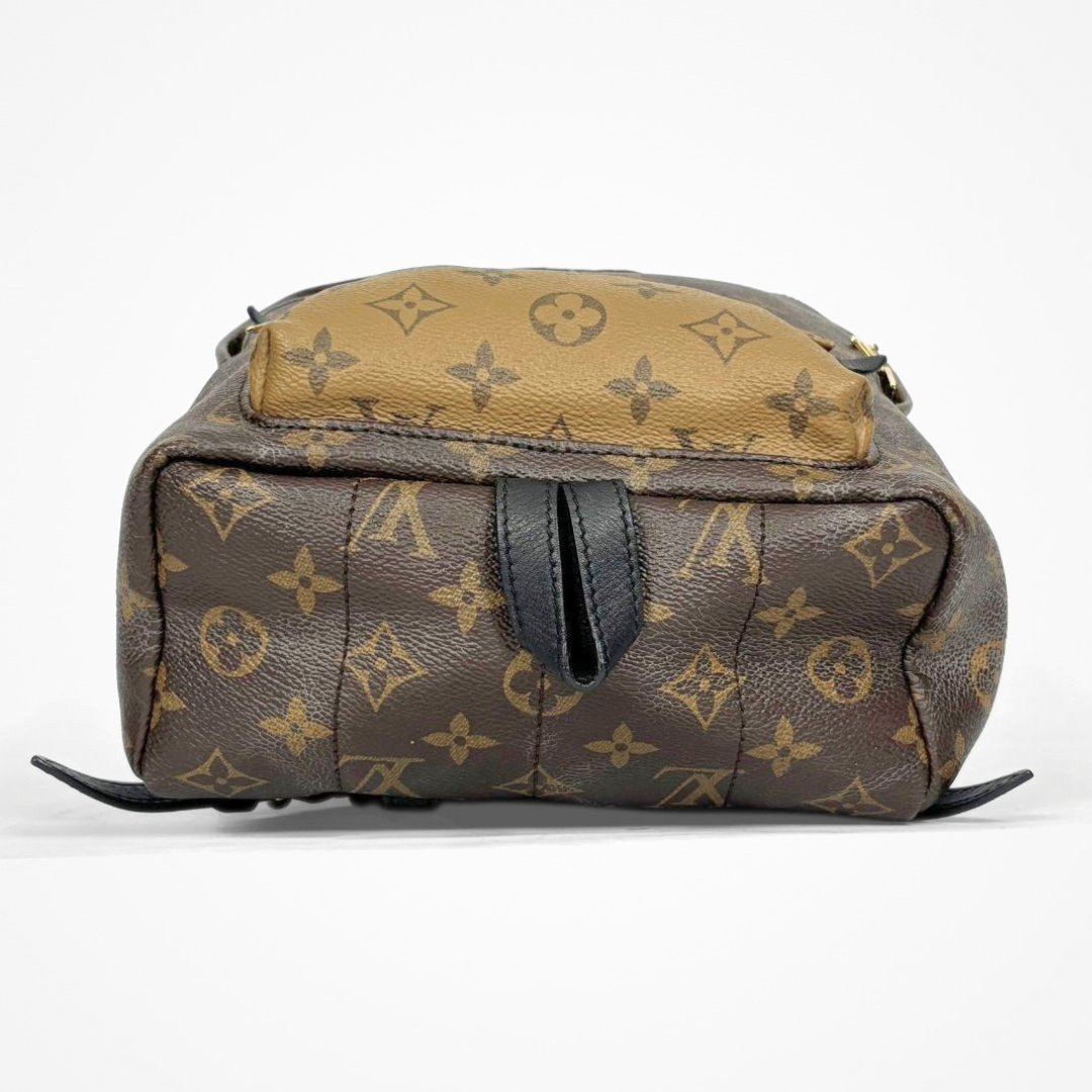 Louis Vuitton backpack with monogram pattern on a white background