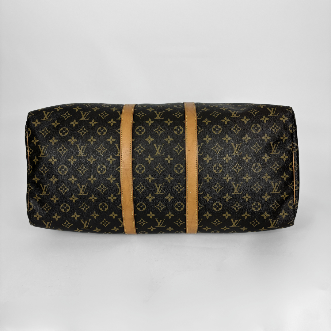 Louis Vuitton monogram duffel bag on a white background