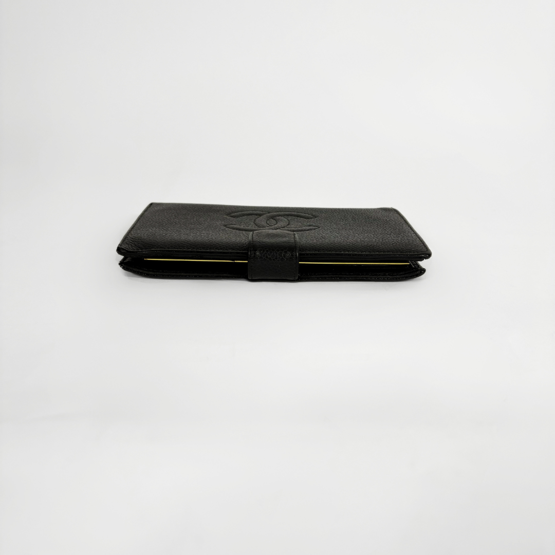 Chanel Wallet large Caviar on a white background