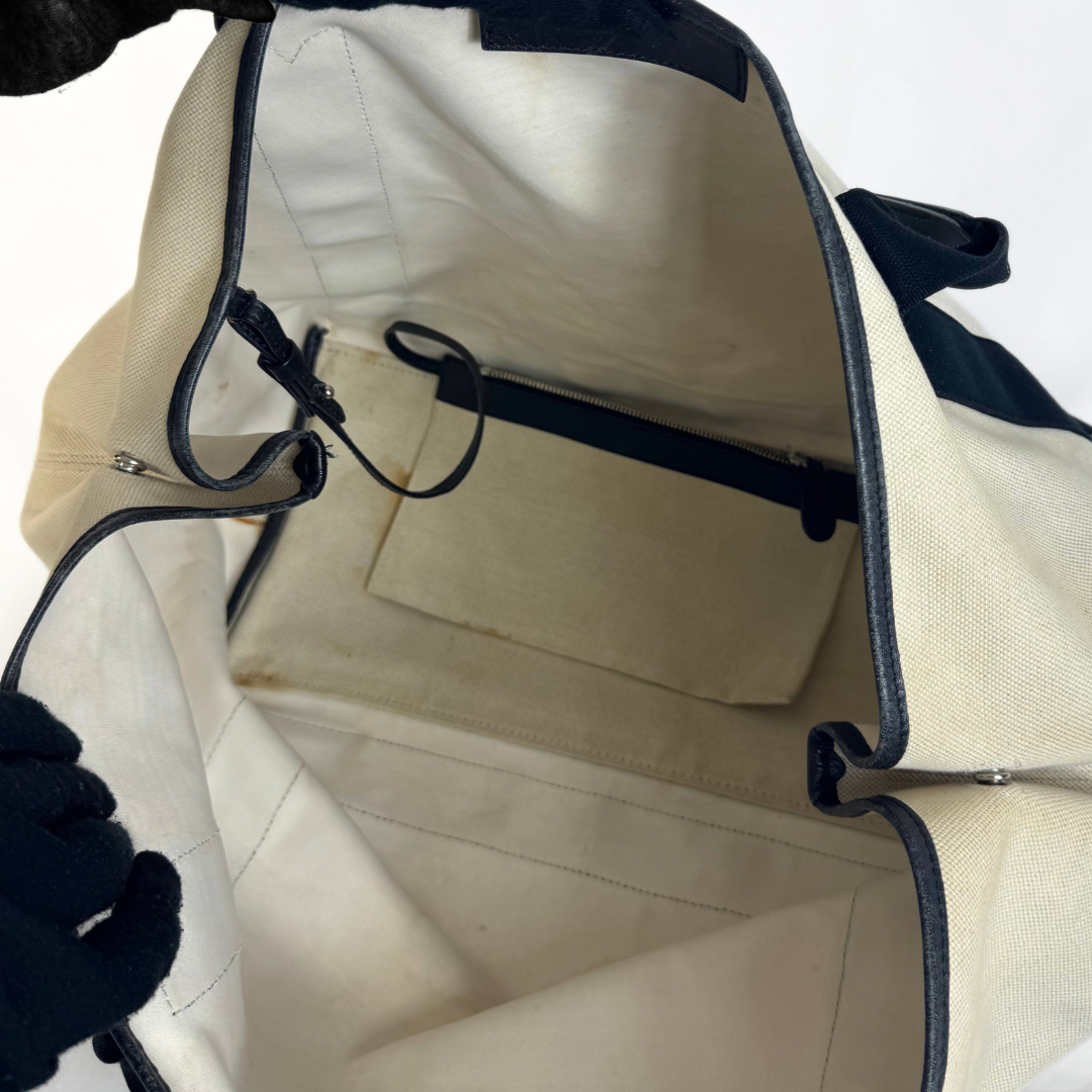 Balenciaga tote bag with black accents on a light gray background