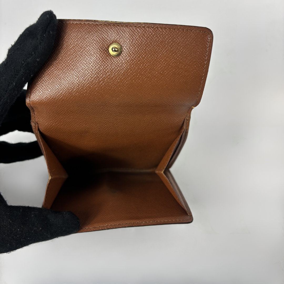Louis Vuitton Druk Wallet on white background