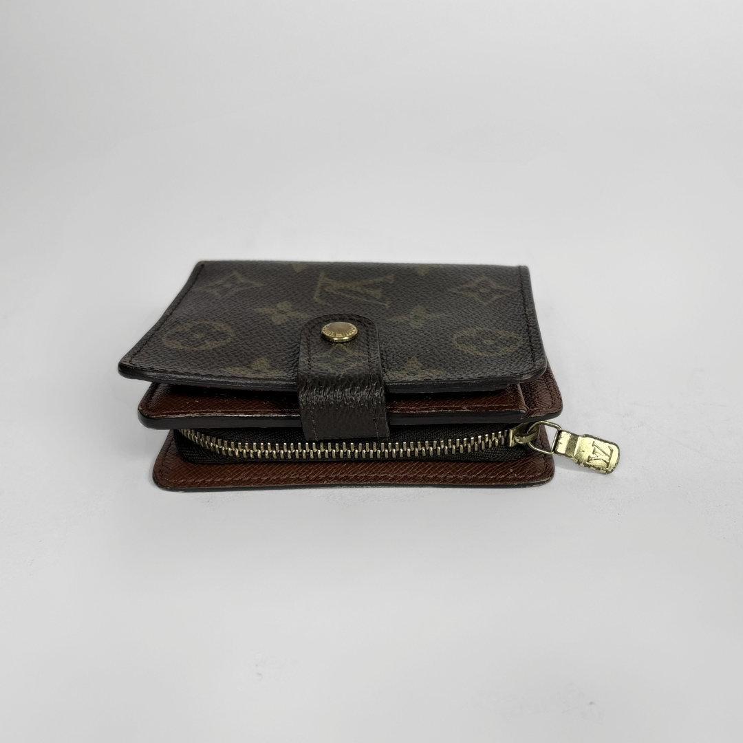 Brown LV wallet with gold accents on a light gray background